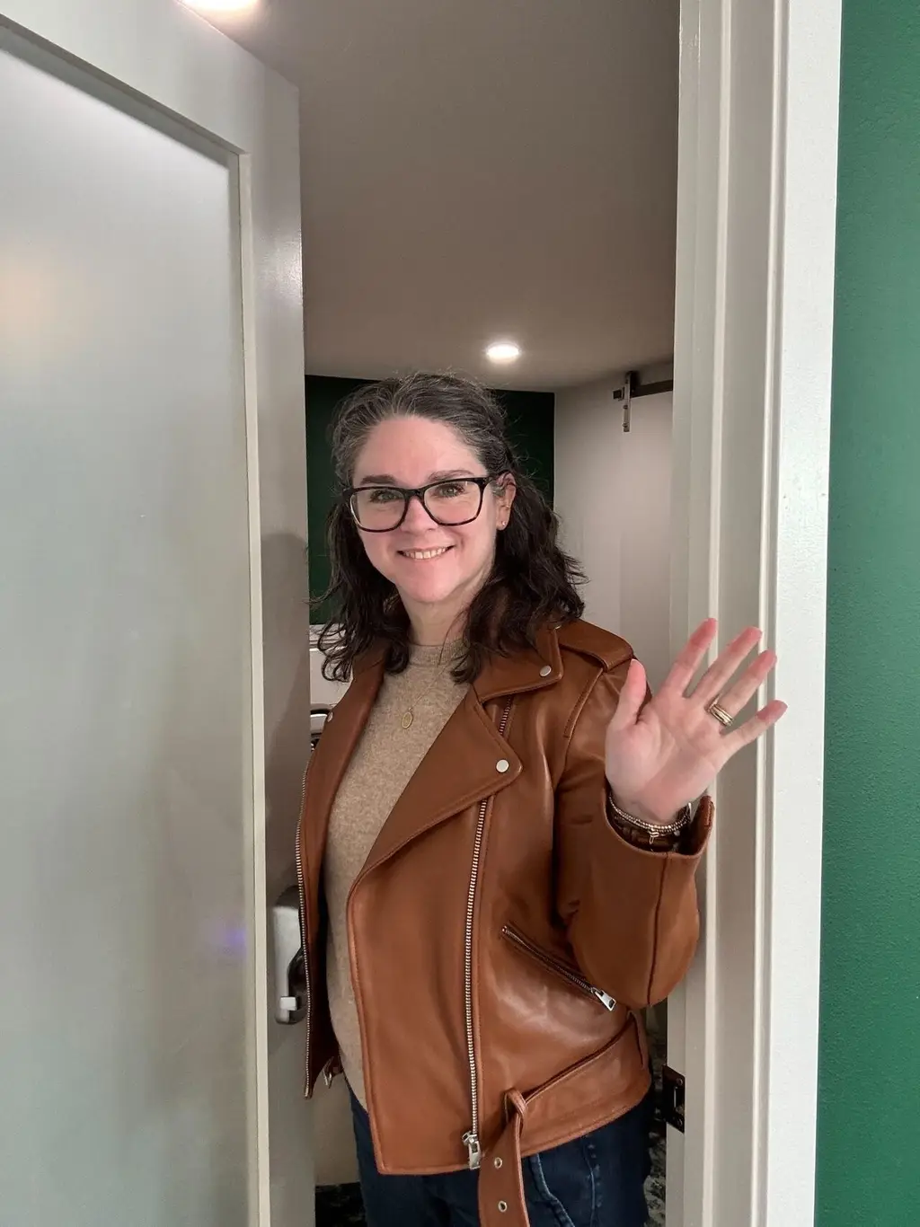 Dr. Kristen Stehling welcoming patients at her office door